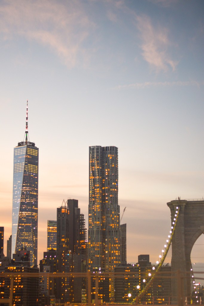 View at sunset of New York skyscrapers from Brooklyn Bridge