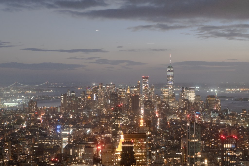 New York skyline from Summit One Vanderbilt observation room at sunset