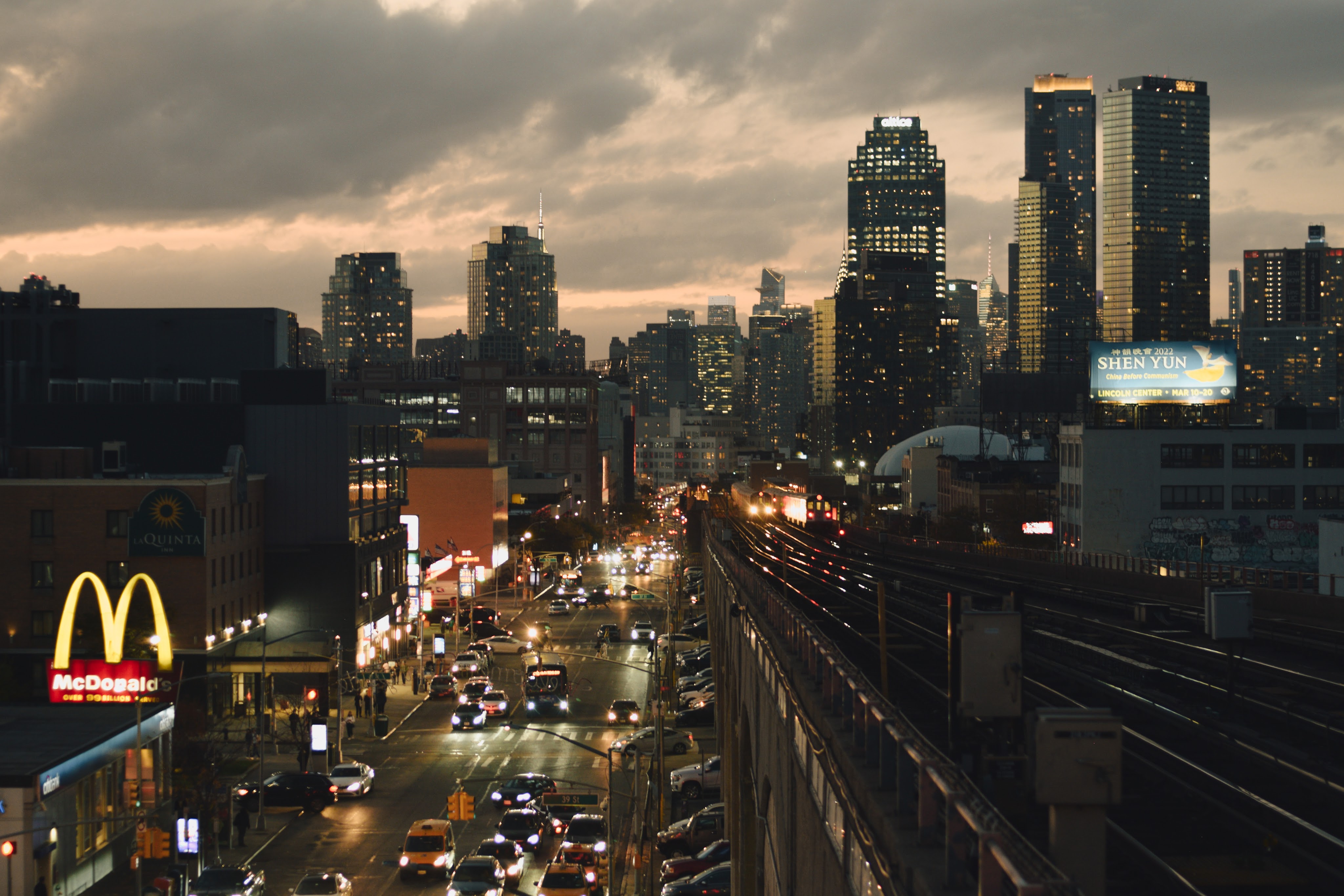 View of New York city at night time from train platform