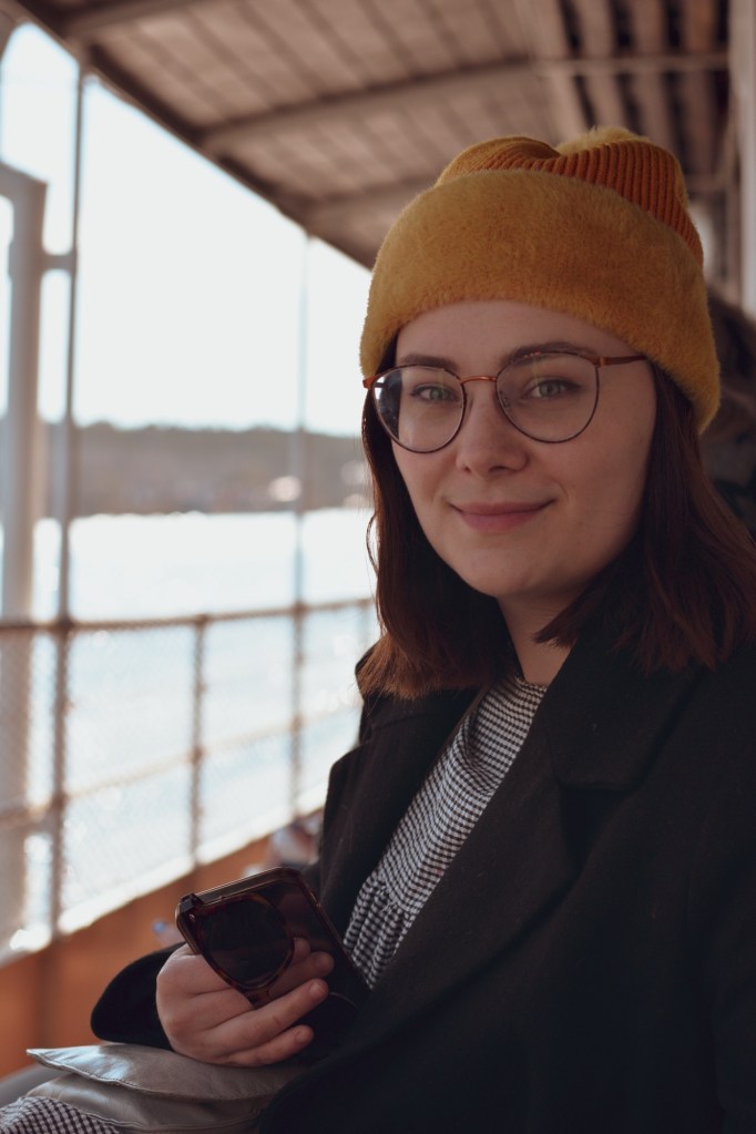 Woman sat on a boat tour of the archipelago’s of Stockholm in spring