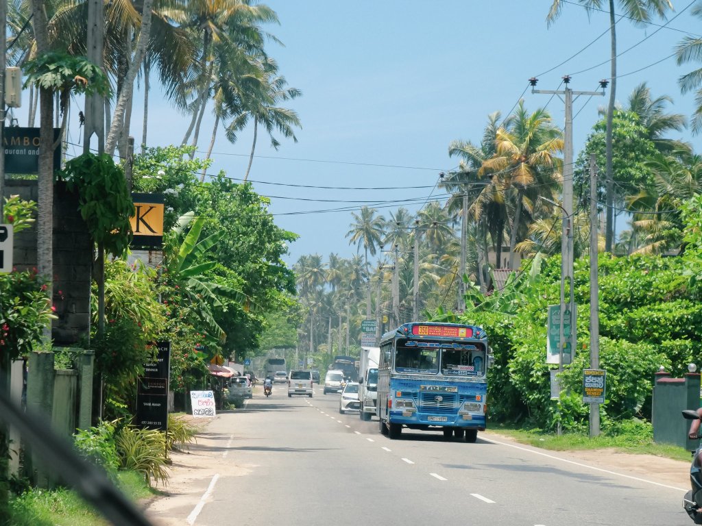 Buses on Sri Lankan Road whilst driving a tuktuk